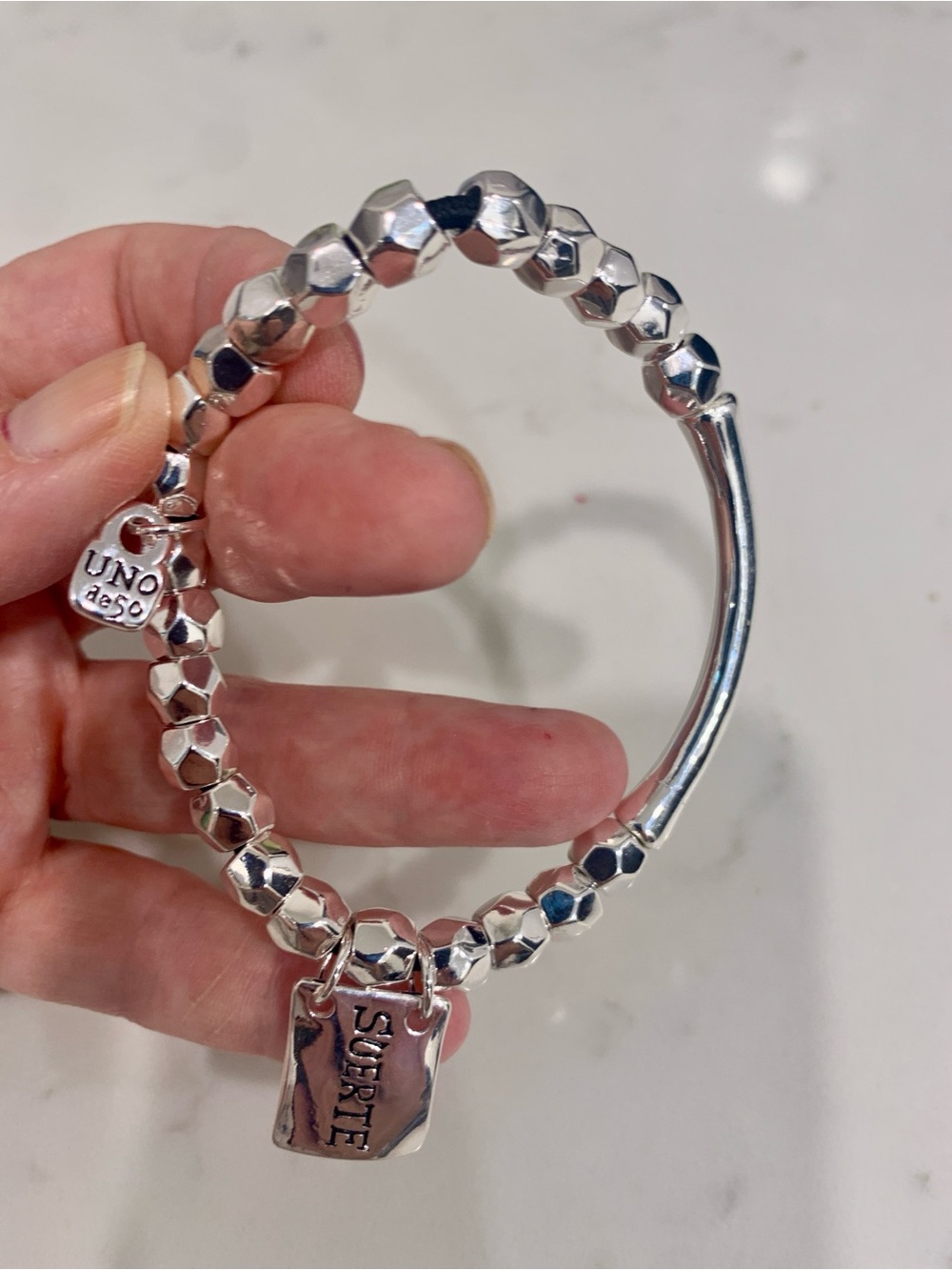 UNO de 50 Silver Faceted Bead Bracelet with 'Suerte' Charm